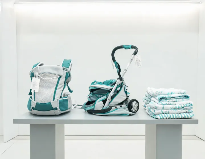 Ergonomic baby carrier and compact stroller assortment